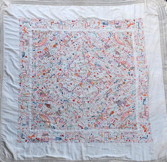 A Chinese embroidered silk table cover, late Qing dynasty, 153cm square excluding fringe